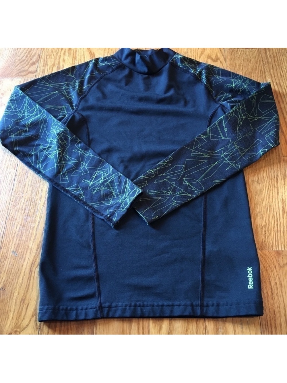 Boys black and neon Reebok Compression shirt size medium. Great for a cold fall